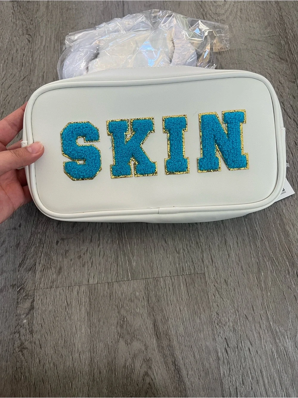 Neutrogena travel cosmetic bag SKIN white and blue + headband and wristband skin